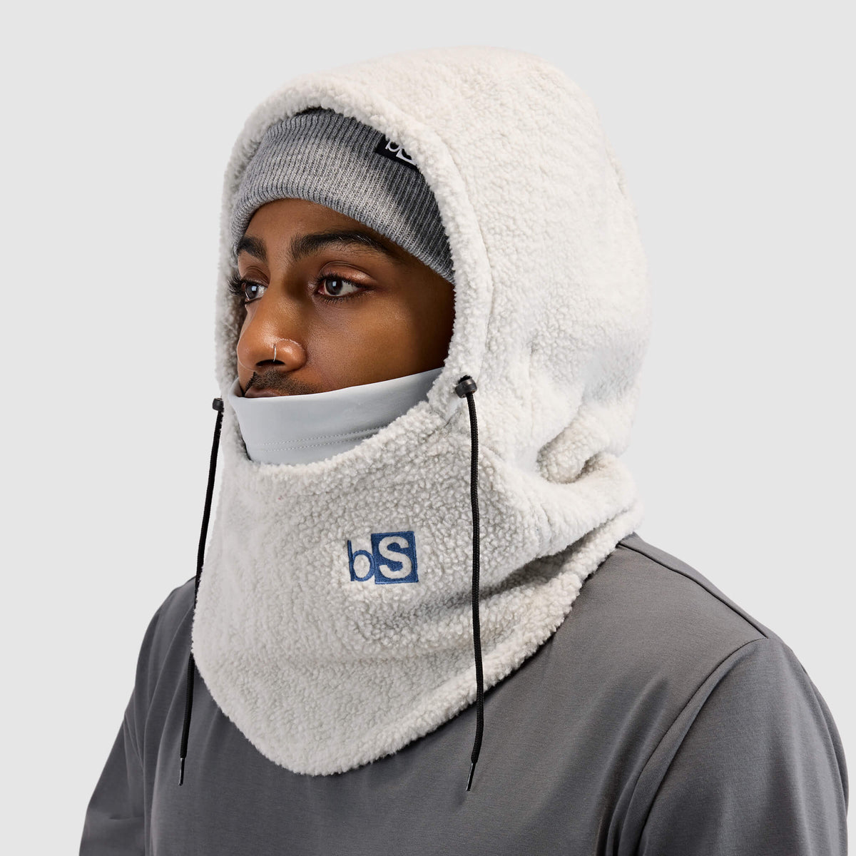 BlackStrap Caldera Hood Sherpa Fleece Overhood Inprint Ash worn by a man wearing a beanie #color_inprint ash