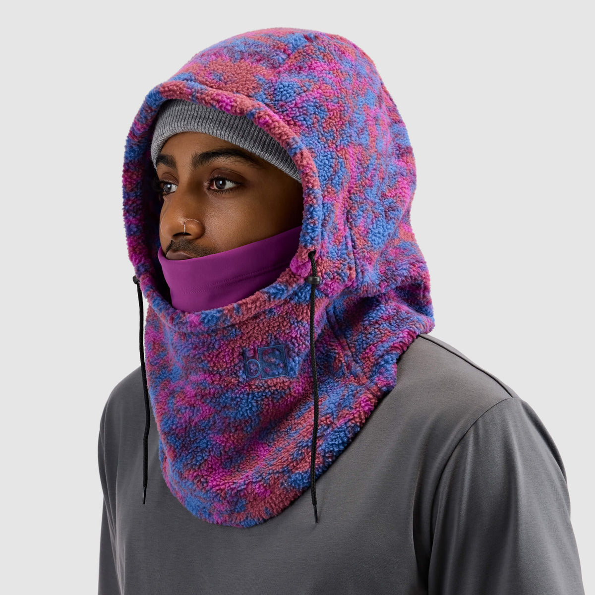 BlackStrap Caldera Hood Sherpa Fleece Overhood Pulse Currant worn by a man wearing a beanie #color_pulse currant
