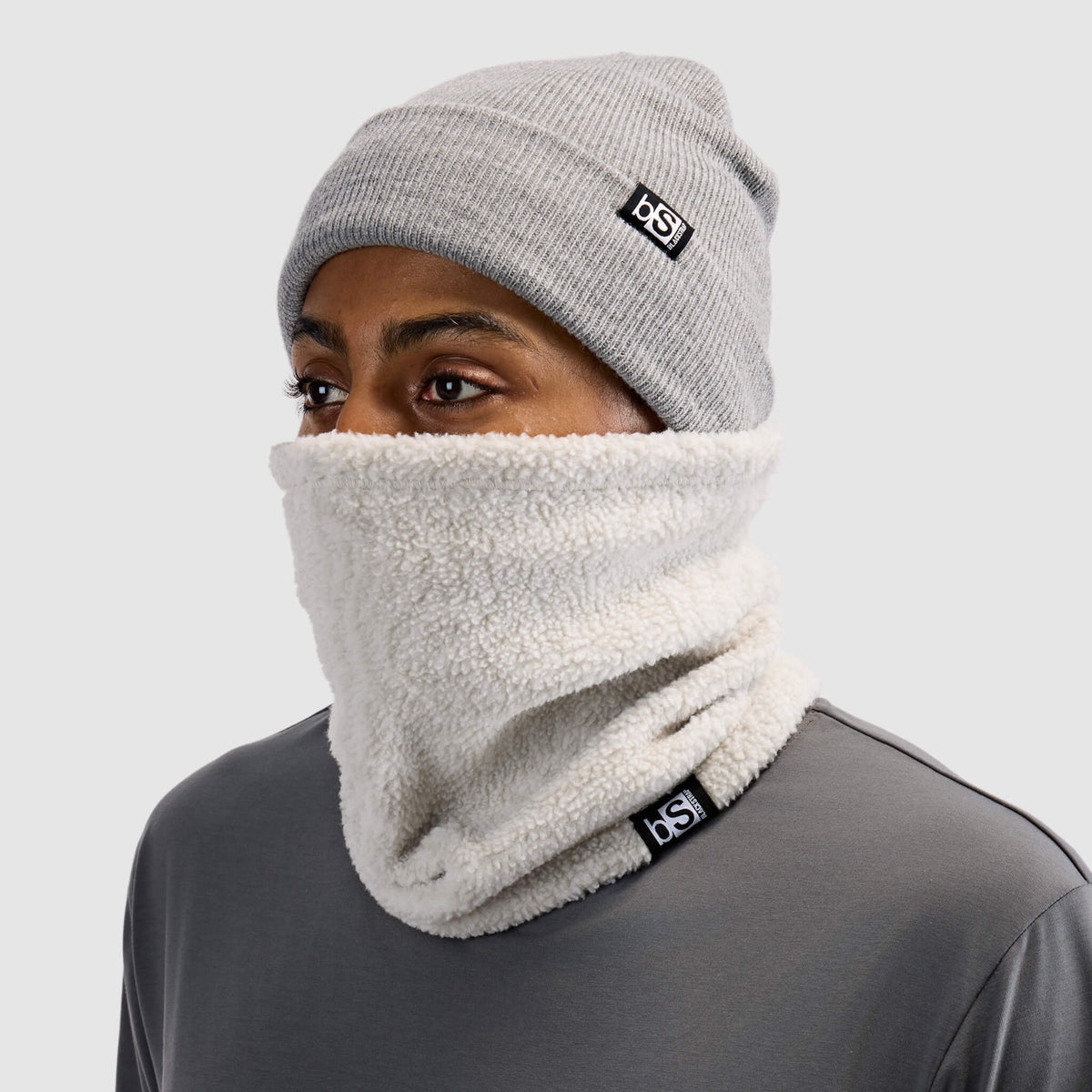 BlackStrap Caldera Sherpa Fleece Tube Neck Gaiter Inprint Ash worn by a man with a beanie #color_inprint ash